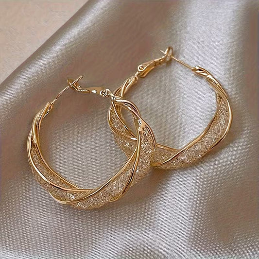 boucles d'oreilles en métal en forme d'anneau