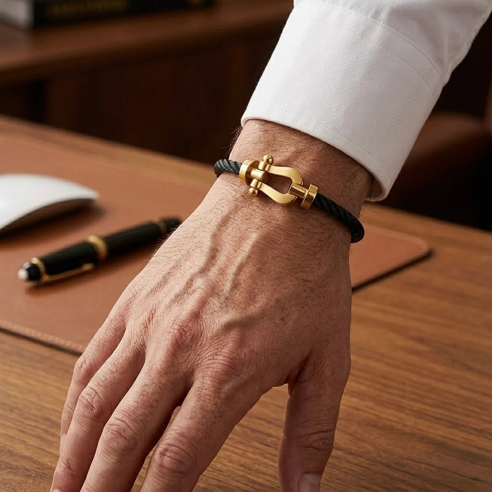BRACELET CABLE NOIR DORE ( FRAD)