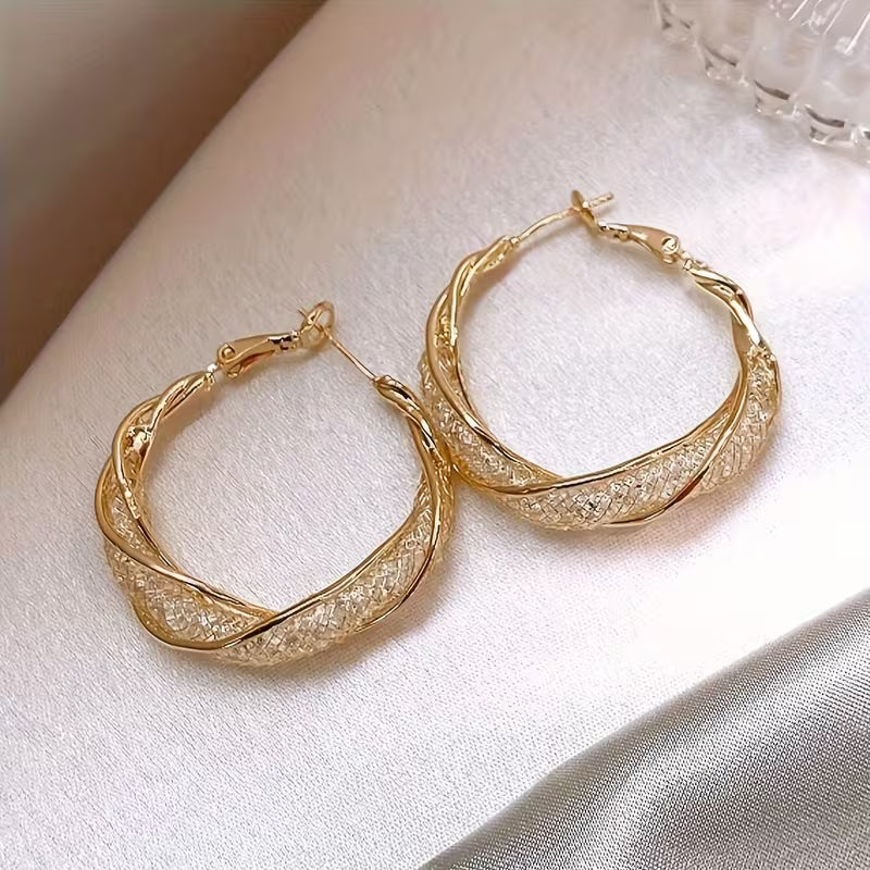 boucles d'oreilles en métal en forme d'anneau